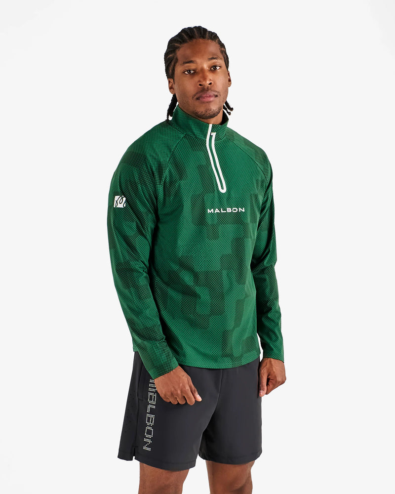 Load image into Gallery viewer, Person wearing a green athletic jacket and shorts with 'Malbon' branding on a white background
